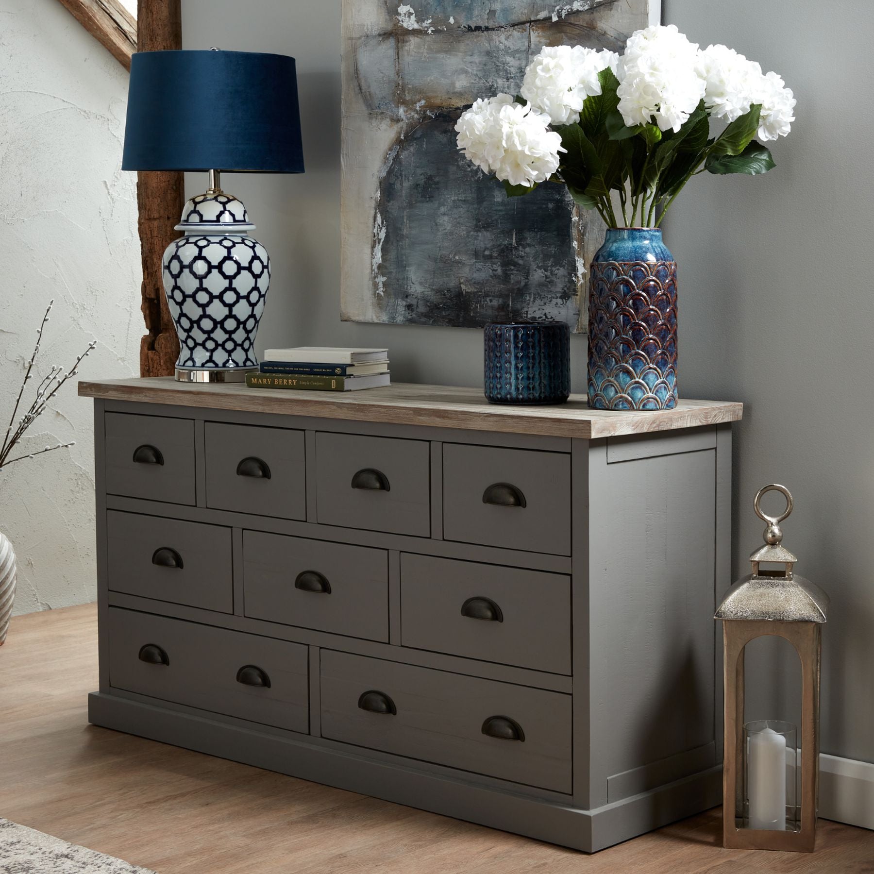 Tarnley Embossed Ceramic Planter styled on a neutral console surface, with natural light highlighting its verdigris glaze and raised vertical relief as a sculptural indoor accent.
