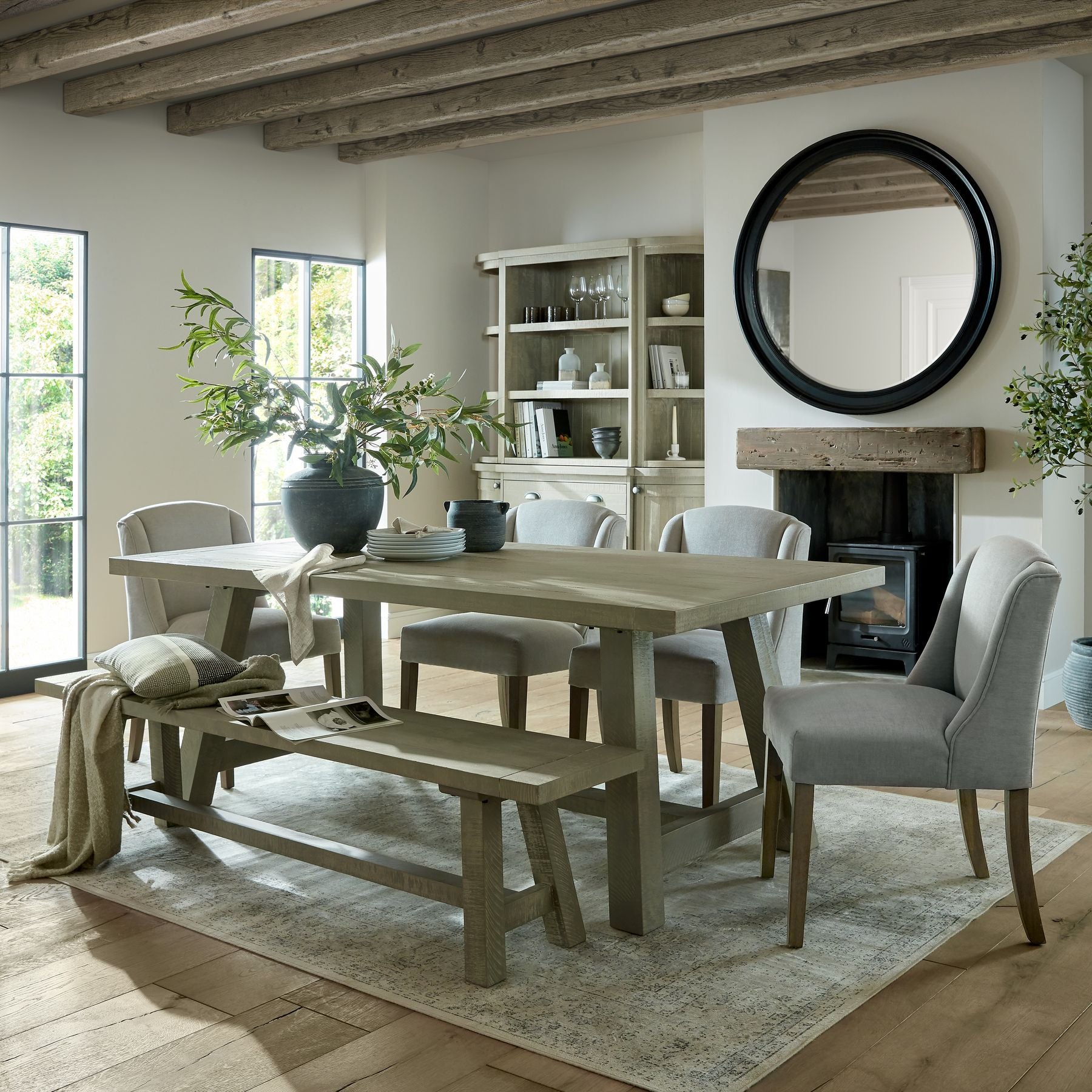 Ashbury Slate Hydria Ceramic Planter displayed on a dining table with decorative bowls and vases in a light-filled contemporary interior.
