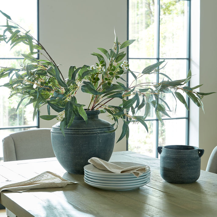Ashbury Slate Hydria Ceramic Planter displayed on a dining table with decorative bowls and vases in a light-filled contemporary interior.