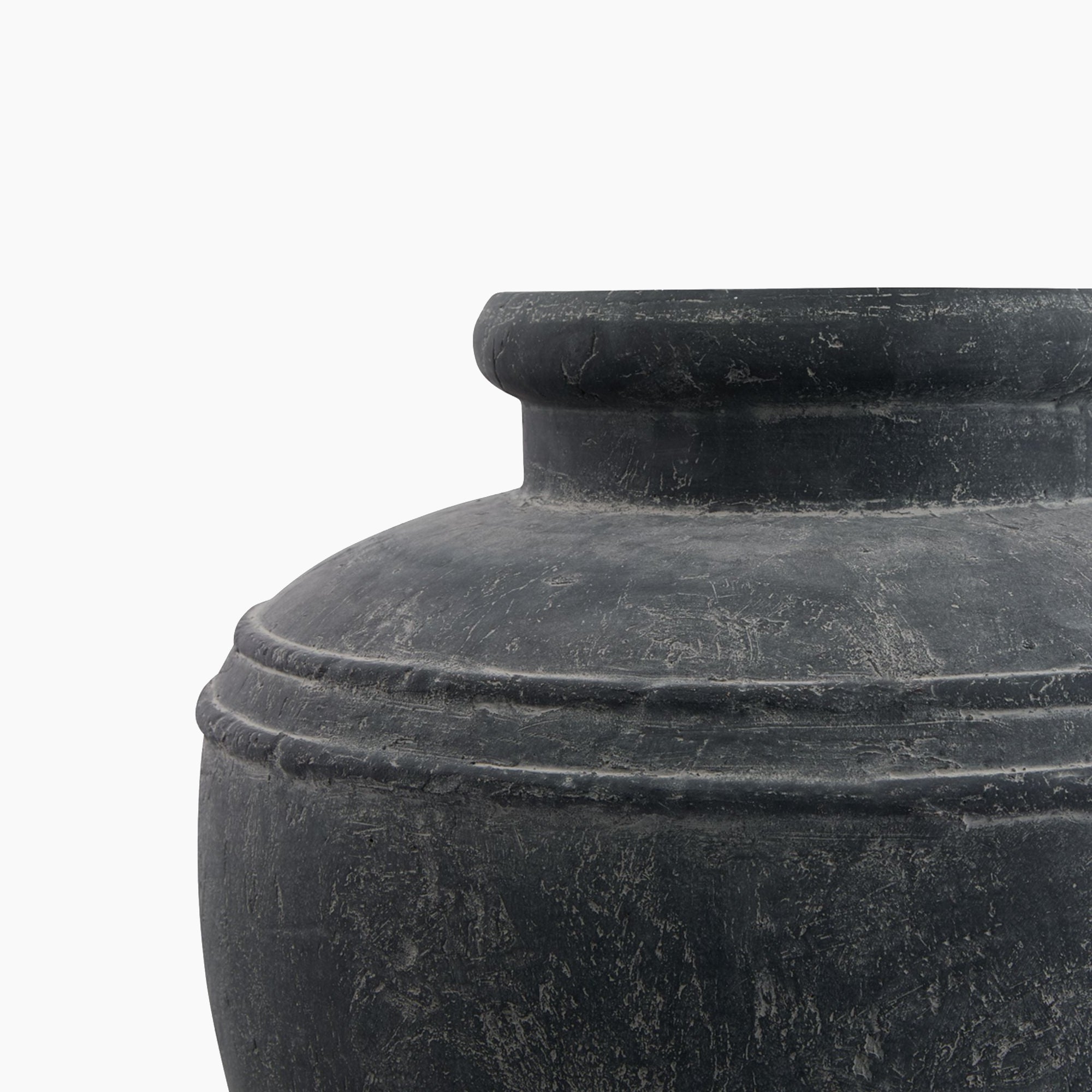 Side profile of the Ashbury Stoneware Water Pot Planter, highlighting its tapered neck, rounded belly, and matte slate glaze with subtle stone-textured variation.