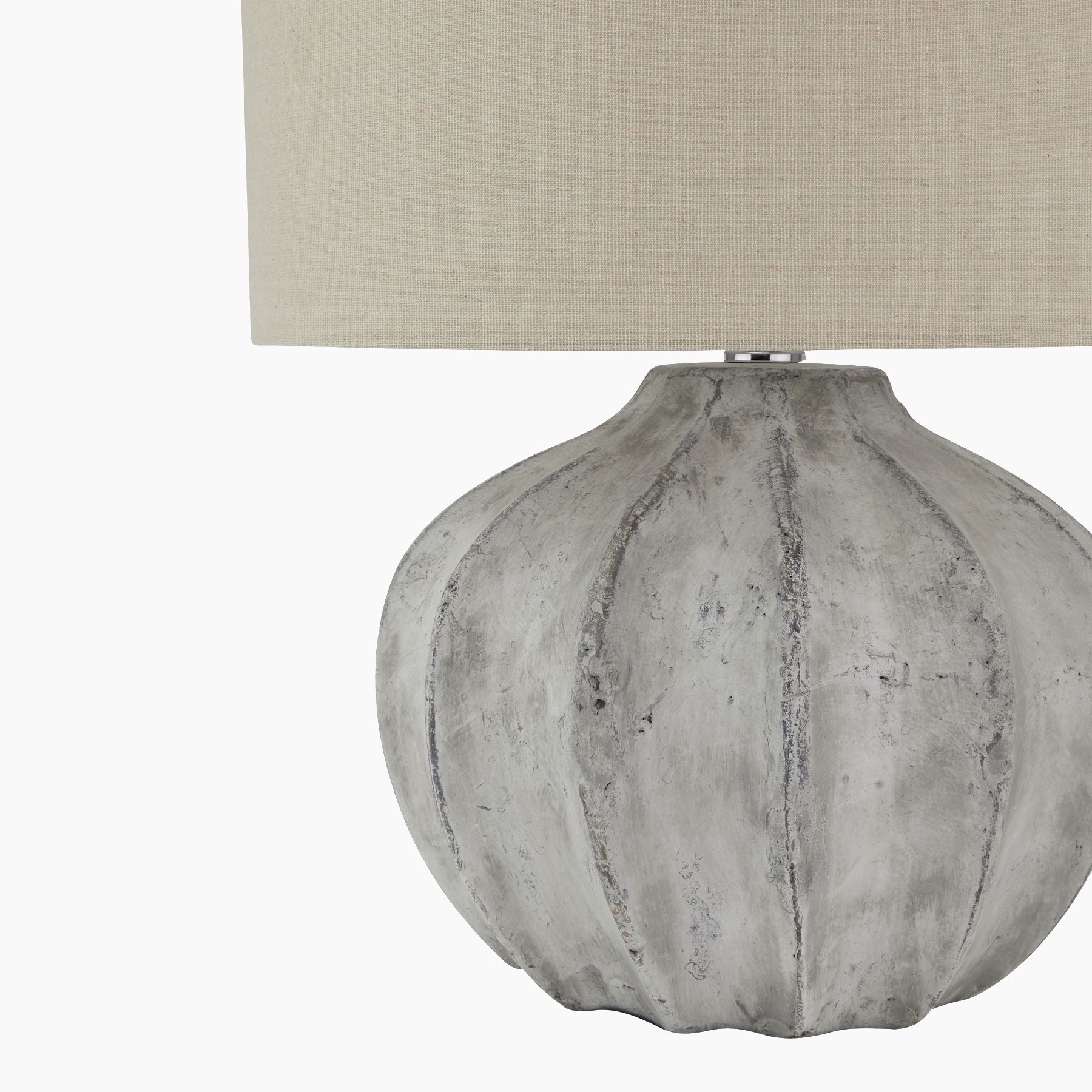 Side angle highlighting ribbed ceramic base and linen shade profile