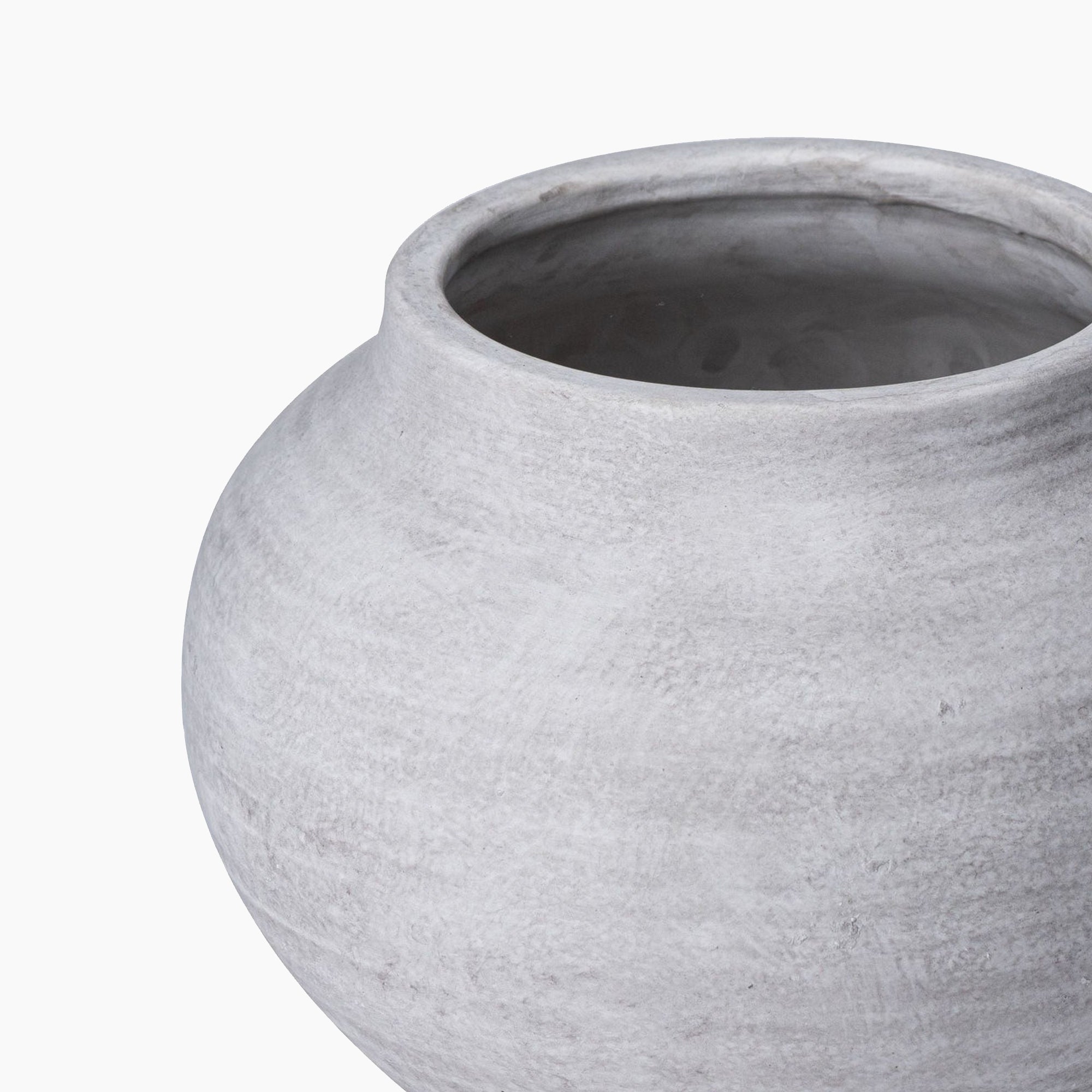 Top-down studio image of the Bramley Stoneware Planter, revealing its wide open mouth and smooth internal cavity, framed by a softly curved rim with a tactile, stone-textured finish.