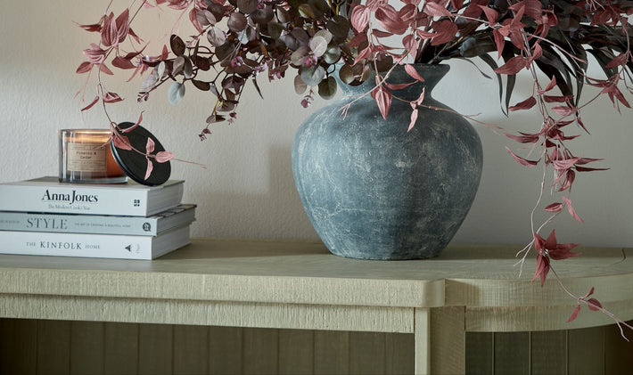 Burgundy eucalyptus faux bunch styled in ceramic vase, perfect as an artificial floral arrangement for living rooms, dining tables, or hallway decor.