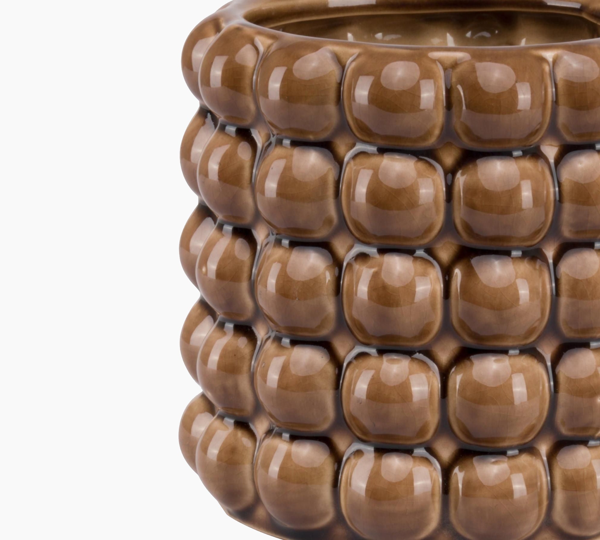 Side profile of the Burwell Caramel Bubble Planter, highlighting its sculptural bubble relief, curved silhouette, and burnished caramel ceramic finish with soft gloss variation.