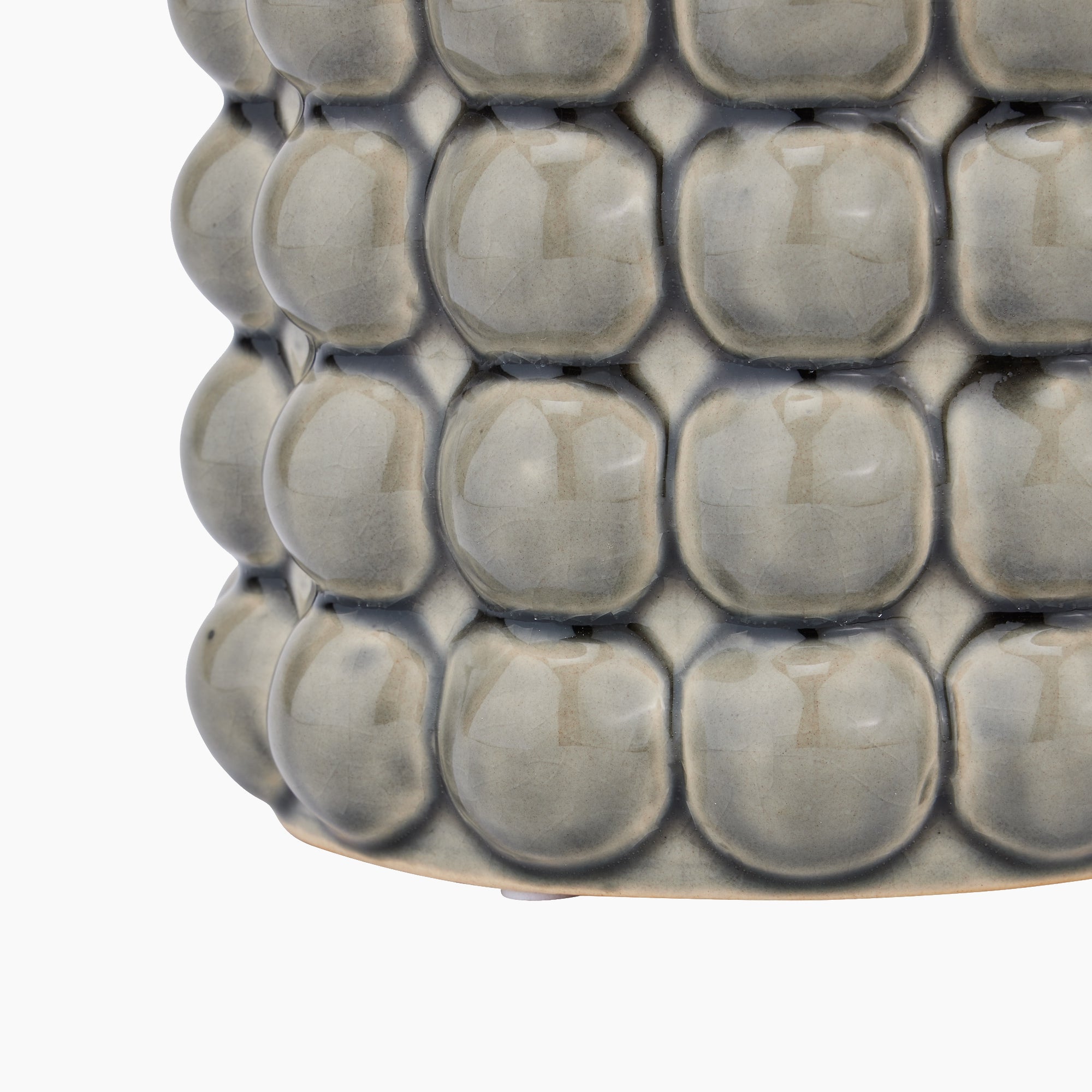 Burwell Stoneware Bubble Planter in profile, revealing the smooth curves and bubble detailing along the sides for a sculptural silhouette.