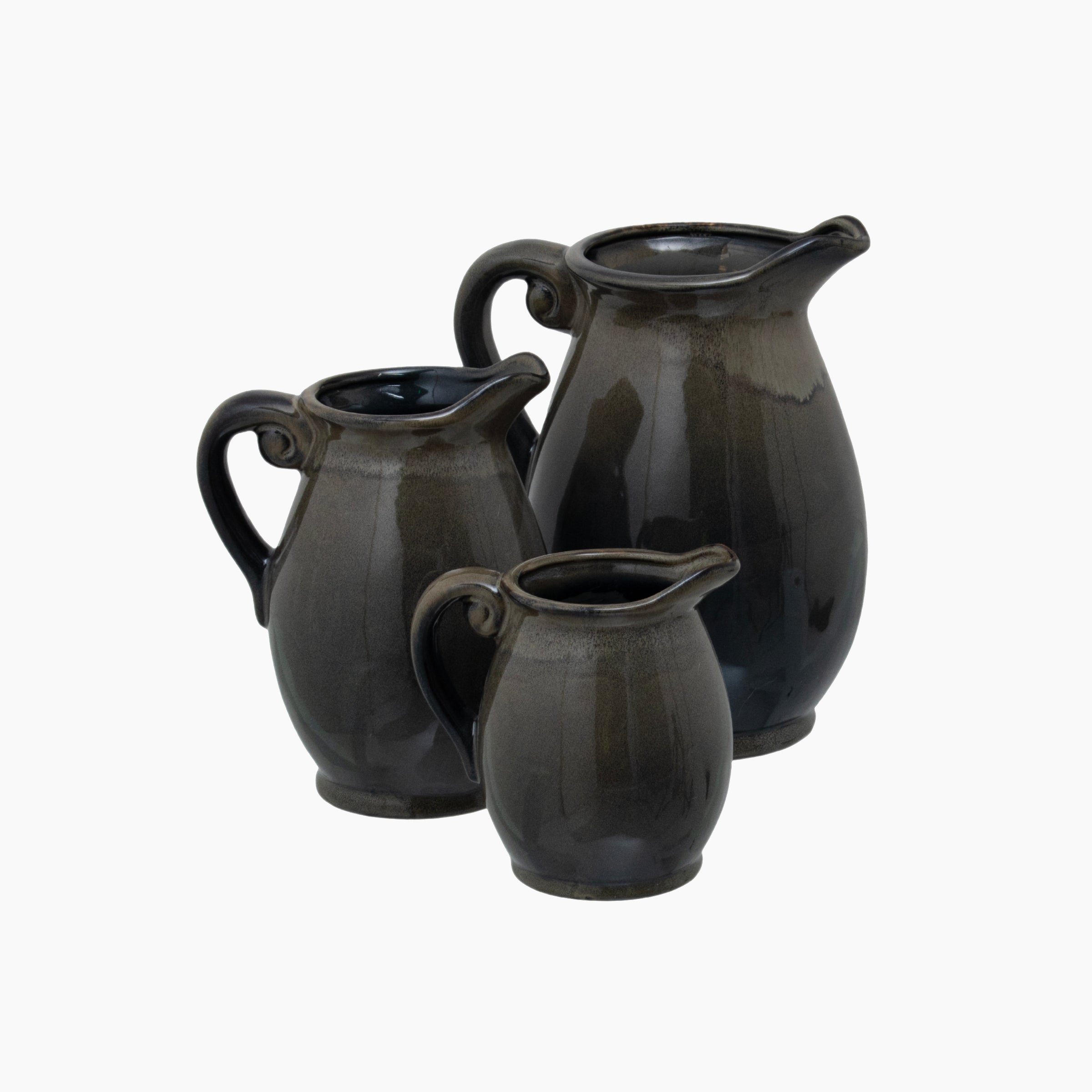 Side profile of the Gleaston Olive Jug Vase, showing the arched handle, tapered body, and organic surface detailing in crater-textured ceramic.