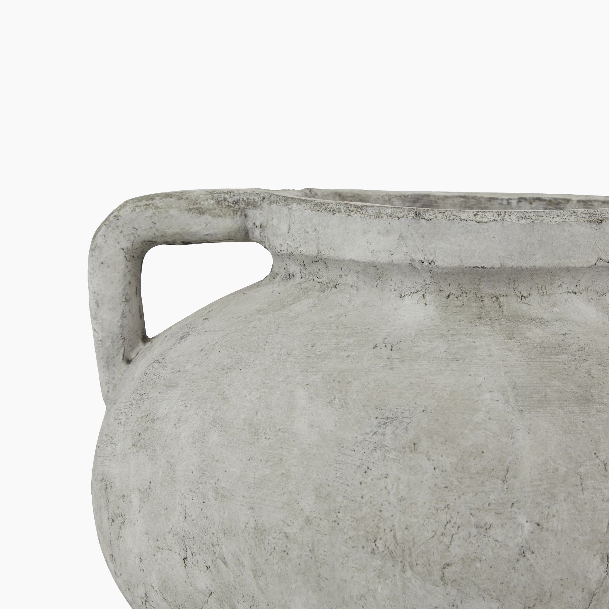 Side profile of the Halden Compact Stoneware Planter showcasing its curved amphora silhouette and muted stone-textured surface.
