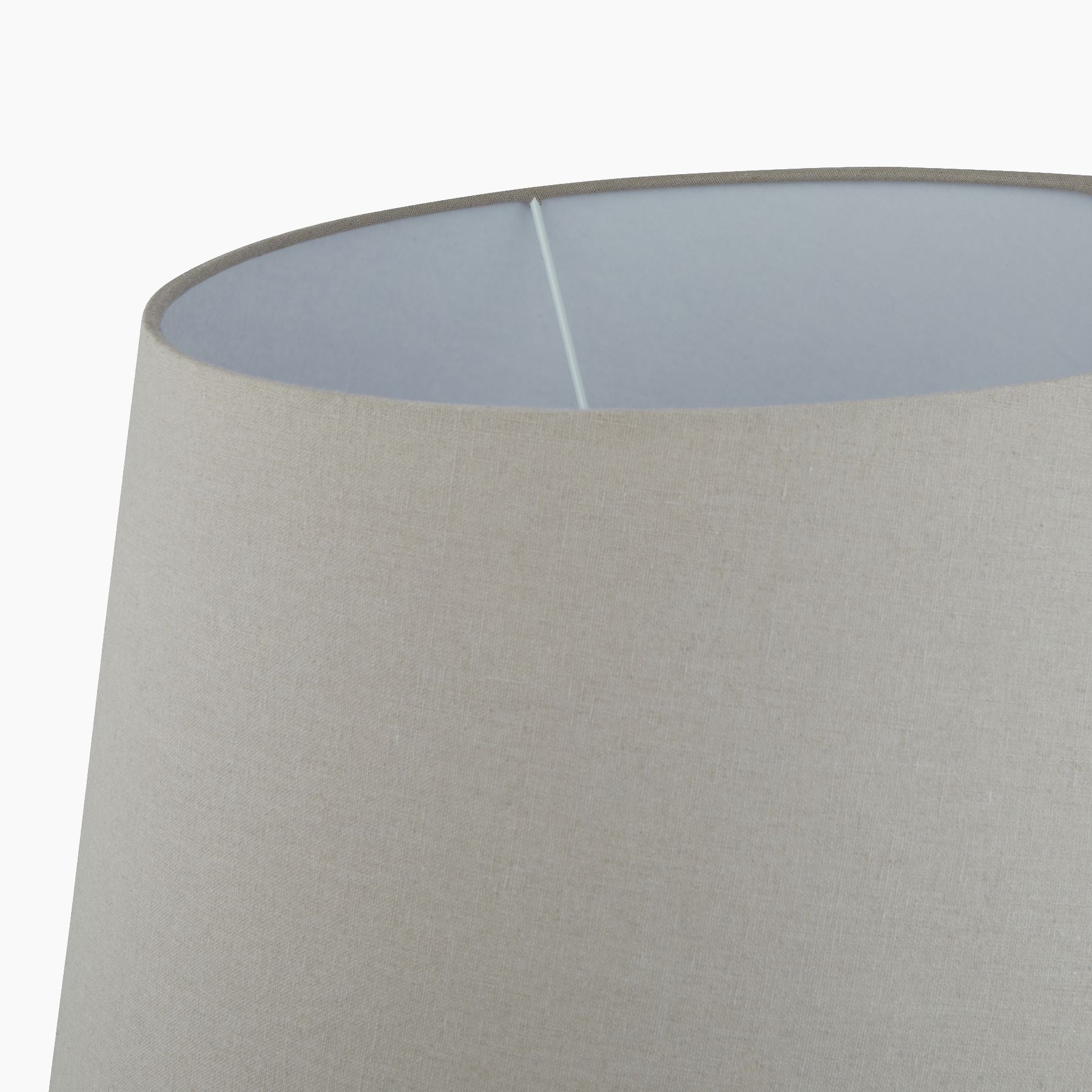 Detail of natural linen shade illustrating weave and warm light diffusion