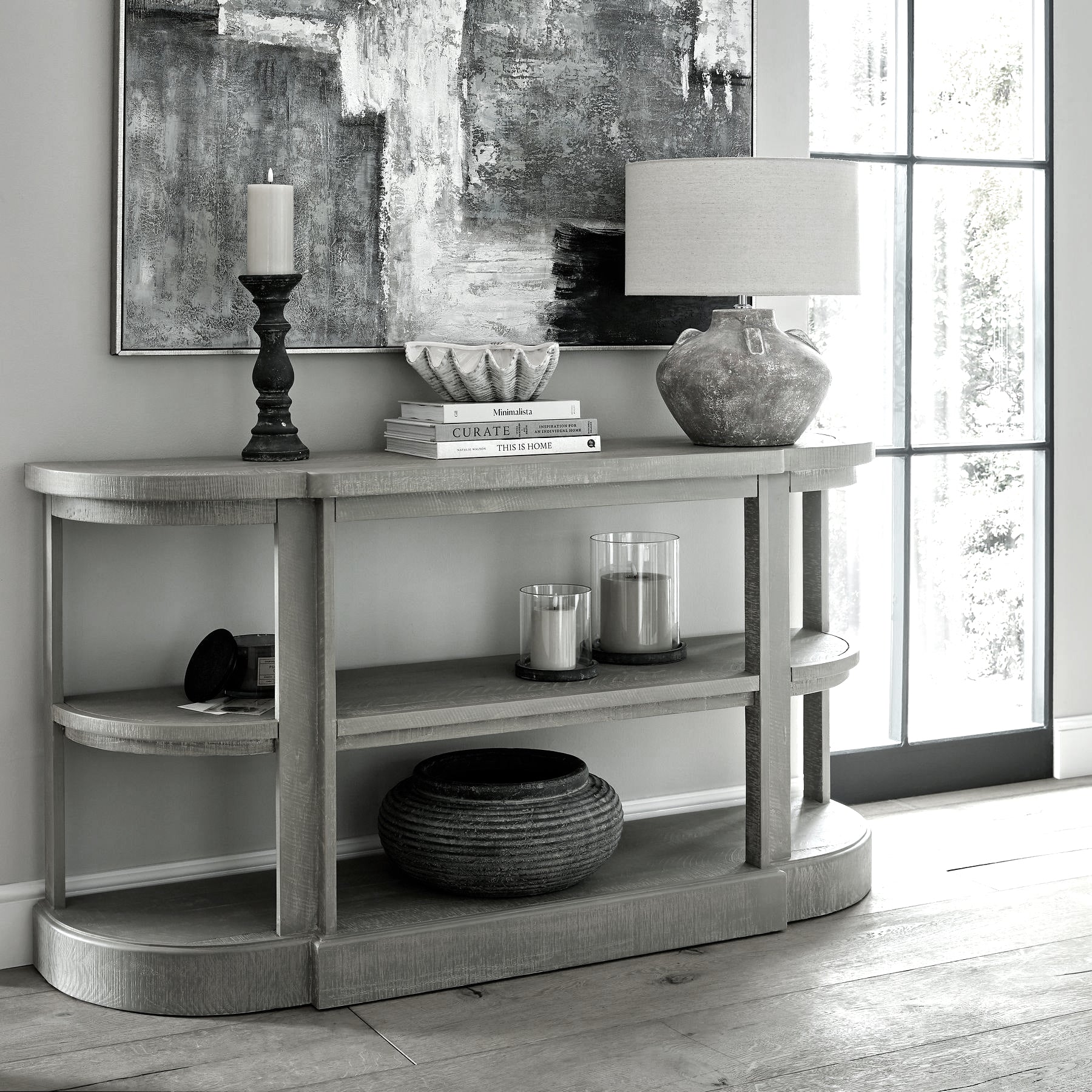 Lifestyle setting featuring the Lowther Ribbed Stoneware Bowl Planter styled on a neutral surface with soft natural light, showing its sculptural form and earthy finish.