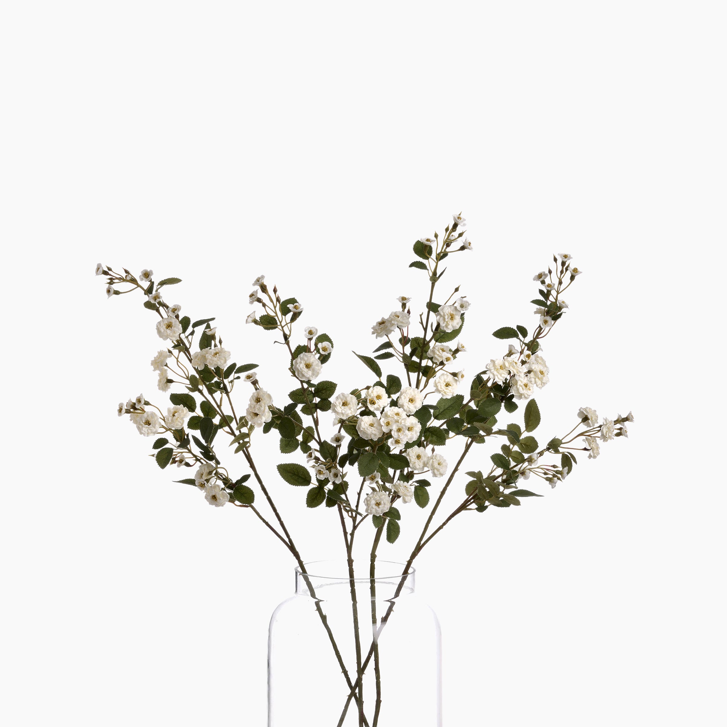 White Wild Meadow Rose Faux Spray stem styled in a tall clear glass vase on a white background, illustrating slender 74 cm height.