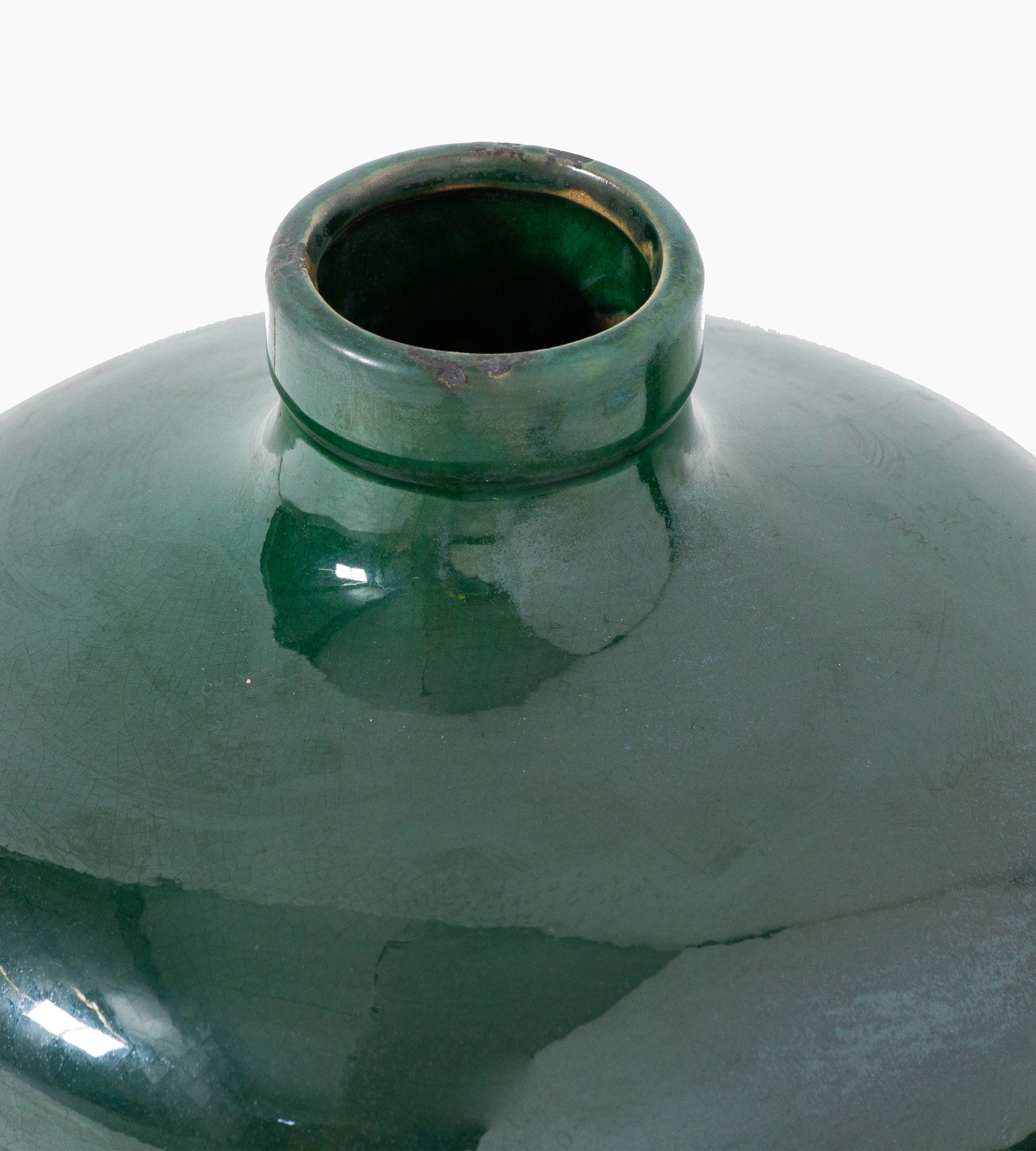 Angled view showing the high-gloss crackle glaze and rounded form of the Whitford Emerald Vase