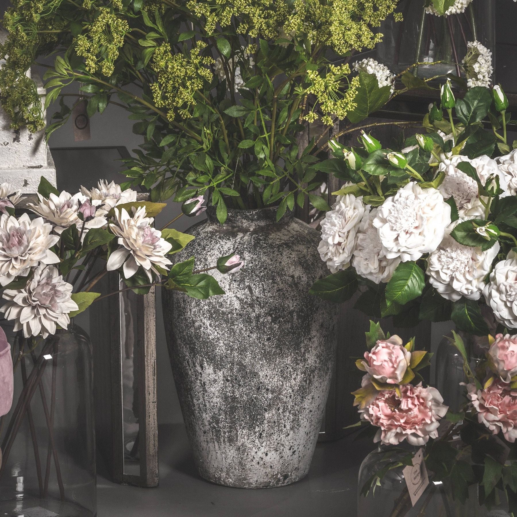 Rudlow Tall Textured Ceramic Vase styled beside a neutral wall with natural light revealing its aged surface and sculptural scale; styled as a standalone floor accent.