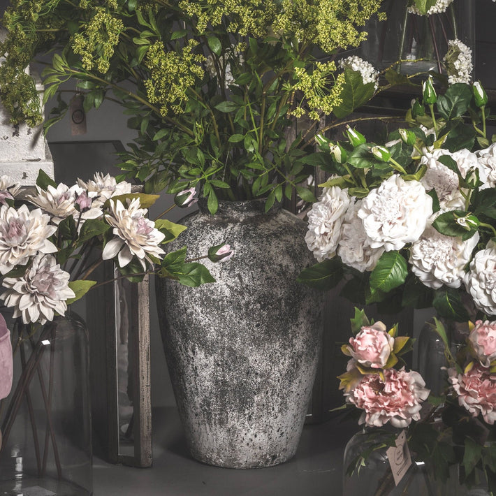 Rudlow Tall Textured Ceramic Vase styled beside a neutral wall with natural light revealing its aged surface and sculptural scale; styled as a standalone floor accent.