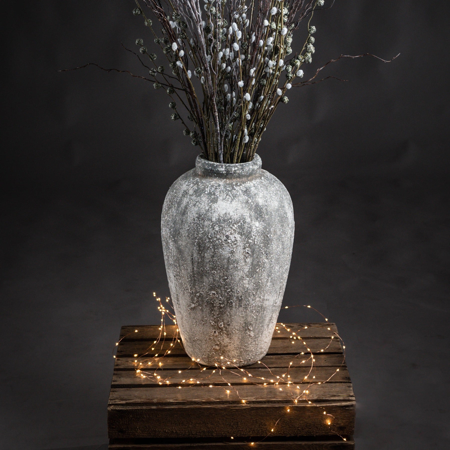 Rudlow Tall Textured Ceramic Vase styled beside a neutral wall with natural light revealing its aged surface and sculptural scale; styled as a standalone floor accent.