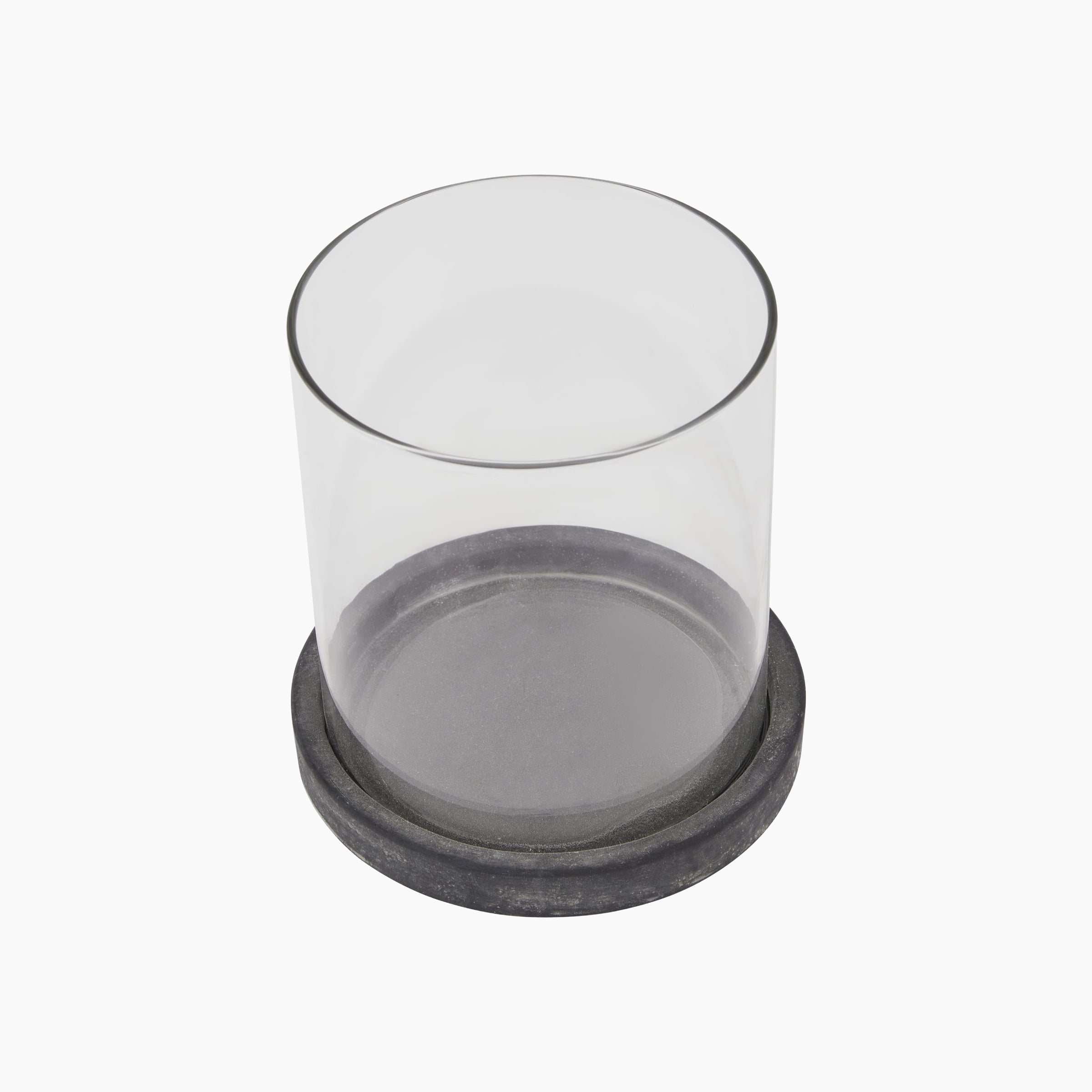 Top-down view of hurricane lantern highlighting glass cylinder, metal loop, and base connection details