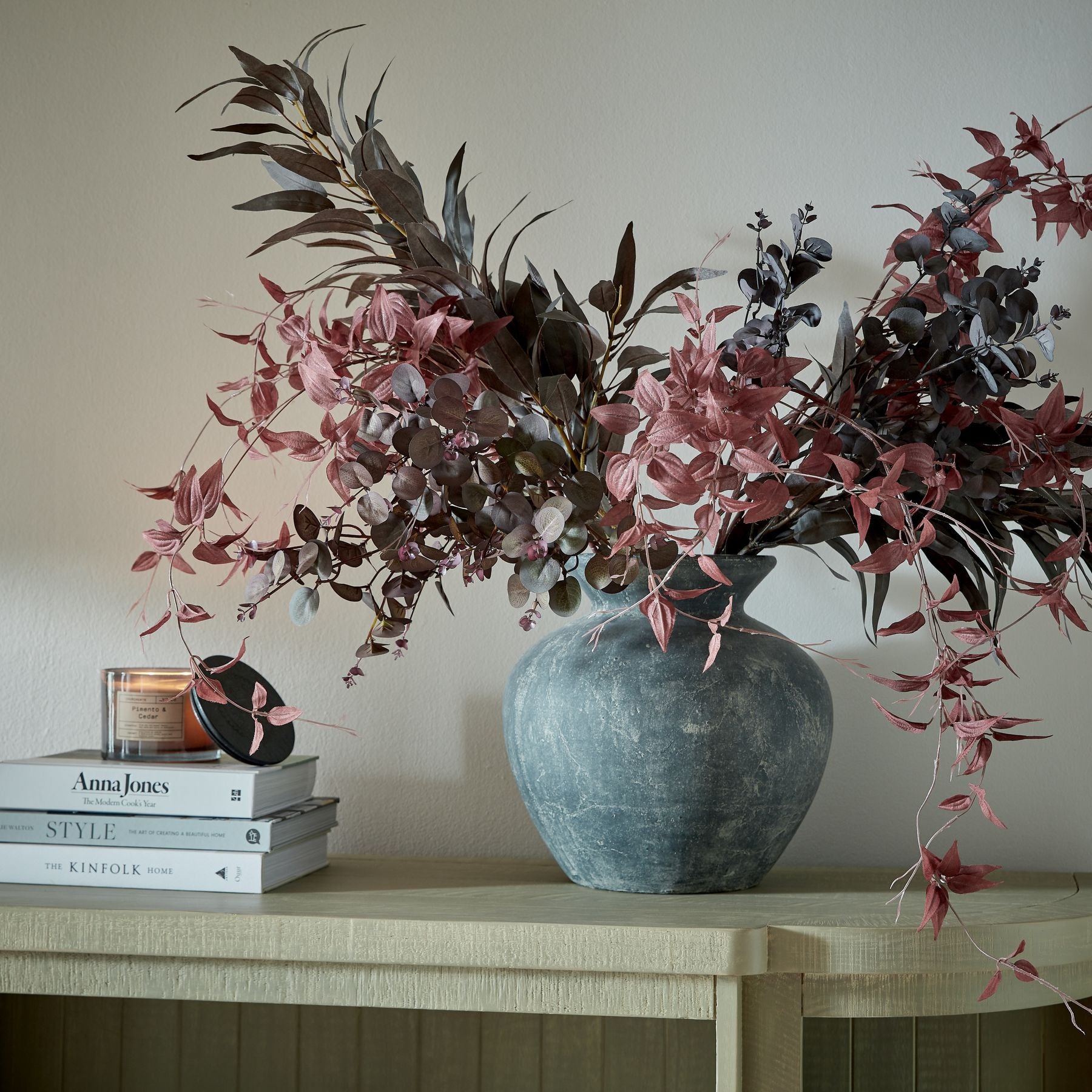 Burgundy eucalyptus faux bunch styled in ceramic vase, perfect as an artificial floral arrangement for living rooms, dining tables, or hallway decor.