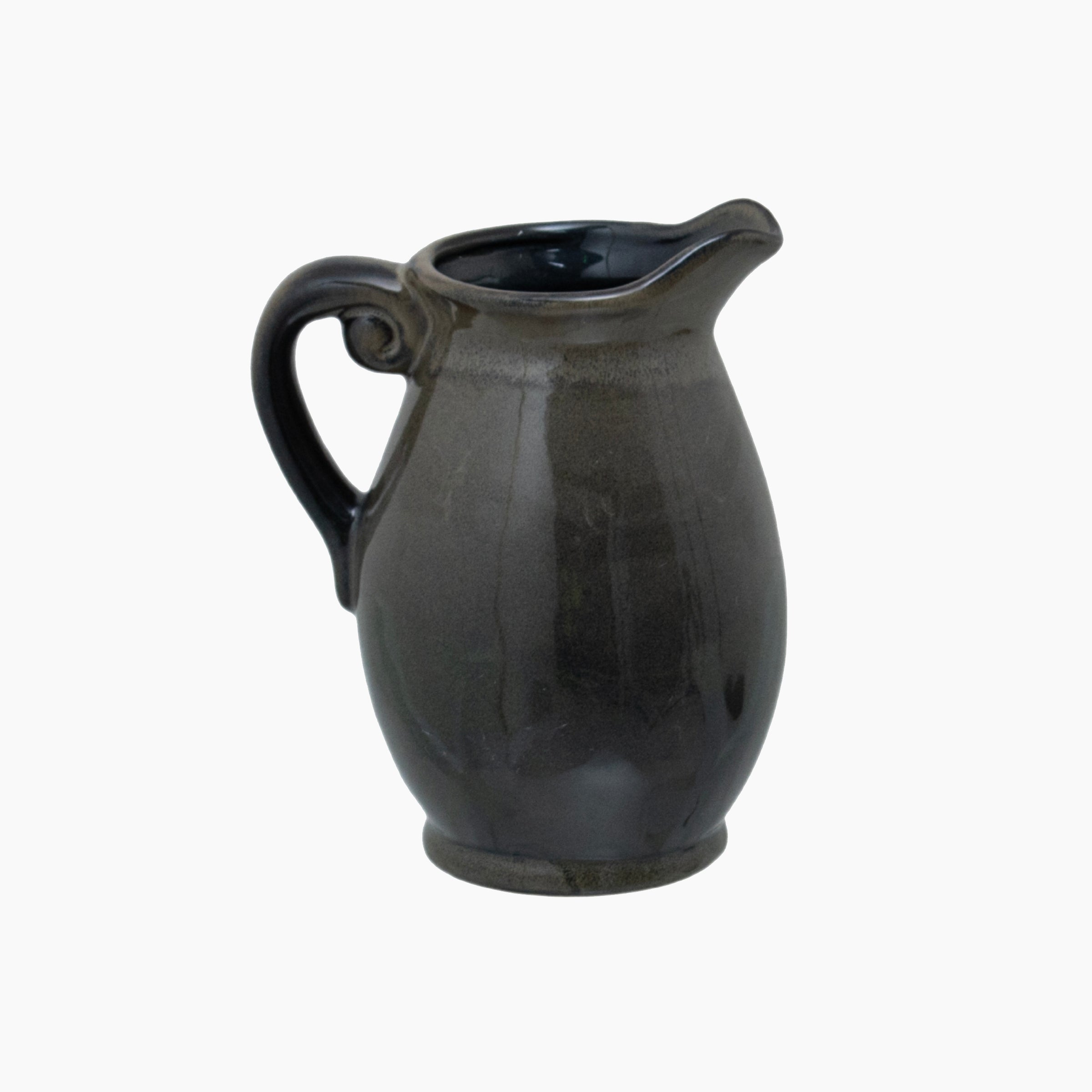 Front view of the Gleaston Olive Ceramic Jug Vase, showing its sculptural single-handle form, cratered olive glaze, and curved pouring lip.