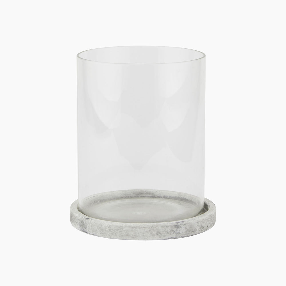Halden Large Hurricane Lantern with clear cylindrical glass and smooth grey concrete base, shown front-on for size and finish detail