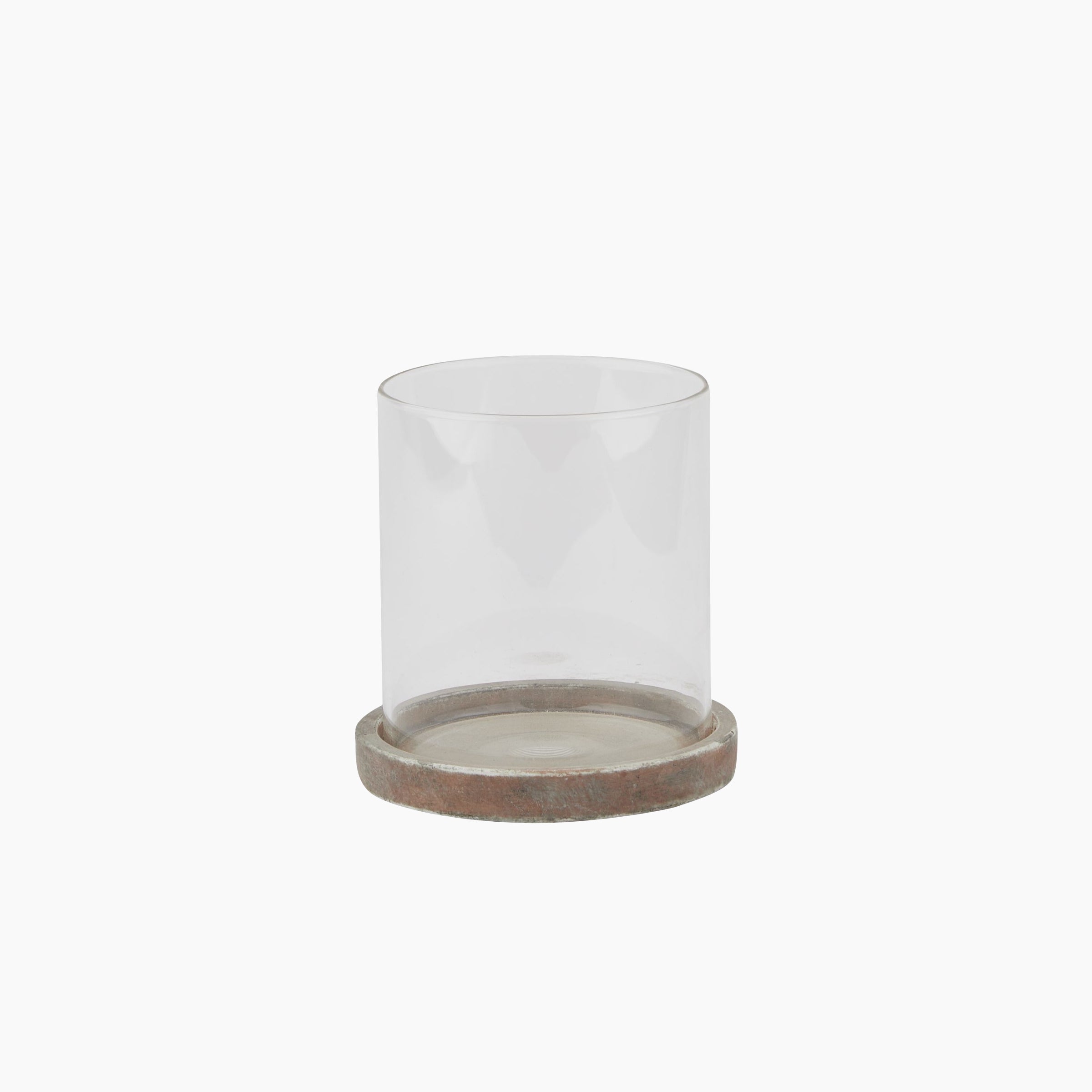 Front view of the Lowther Hurricane Lantern with clay brown stoneware base and clear glass shade.