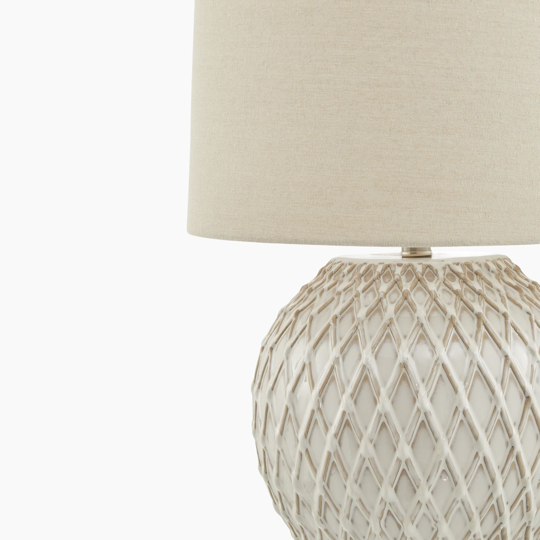 Side angle highlighting diamond lattice ceramic base and linen shade profile