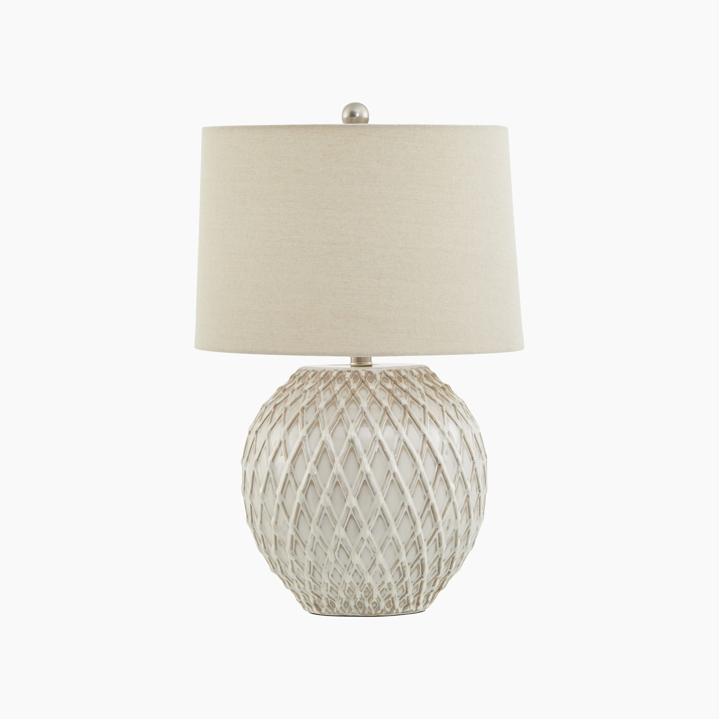 Front view of lattice-textured cream ceramic table lamp with neutral linen shade