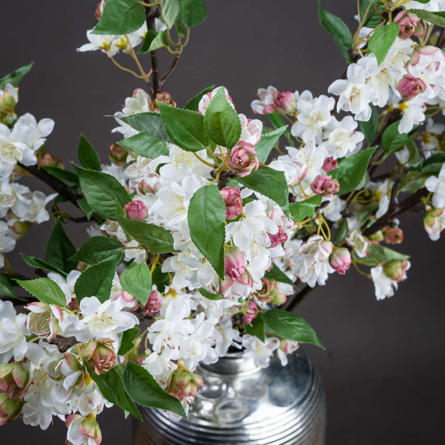 Close-up of ivory faux cherry blossom petals with soft veining and natural texture