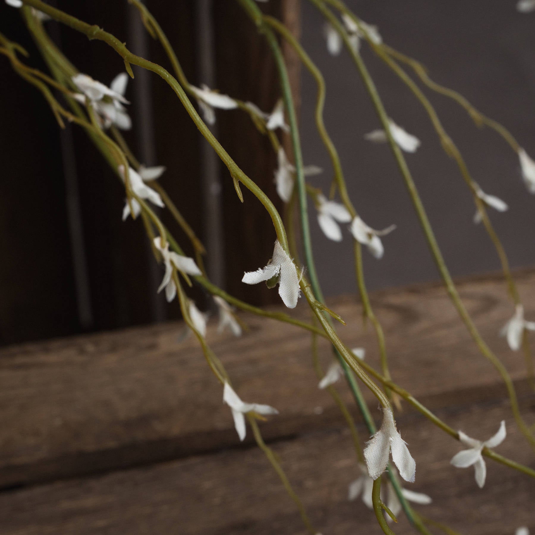 Detailed view of the White Willow Faux Spray showing realistic soft white buds.